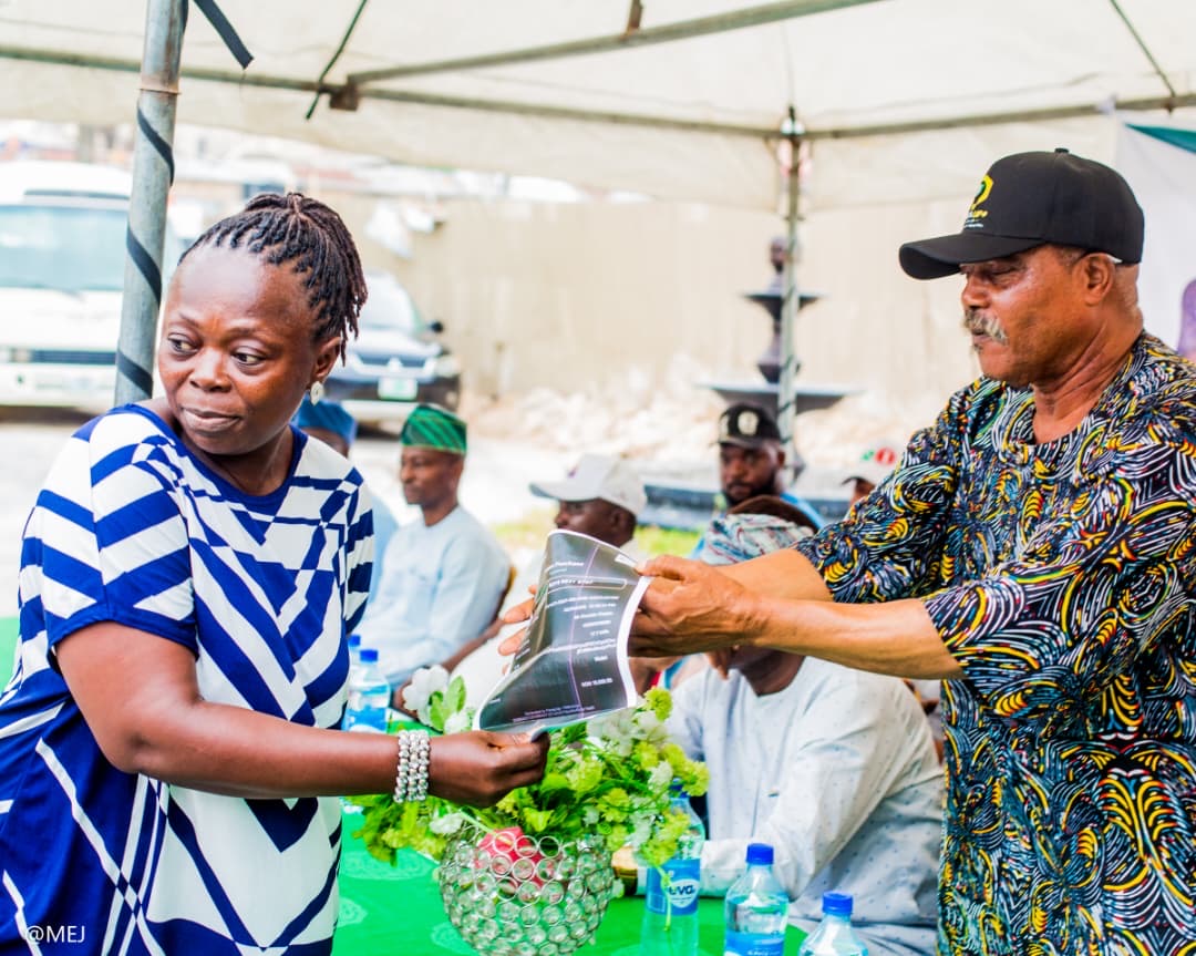 A beneficiary receiving her prepaid electricity token slip